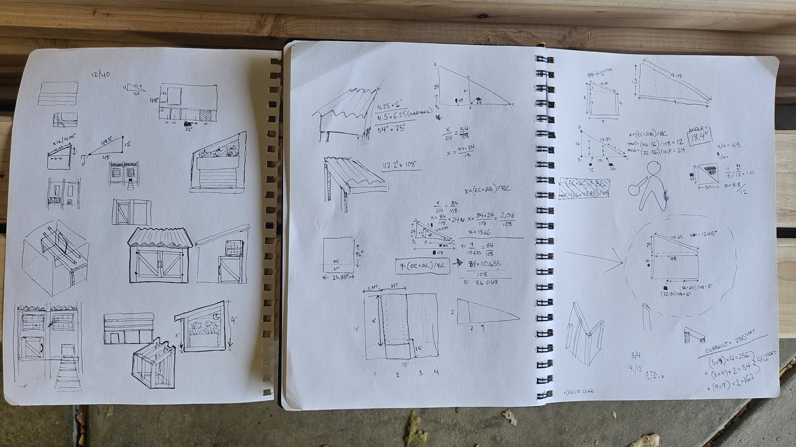 An open sketchbook with elevation drawings, dimensions and angle calculations.
