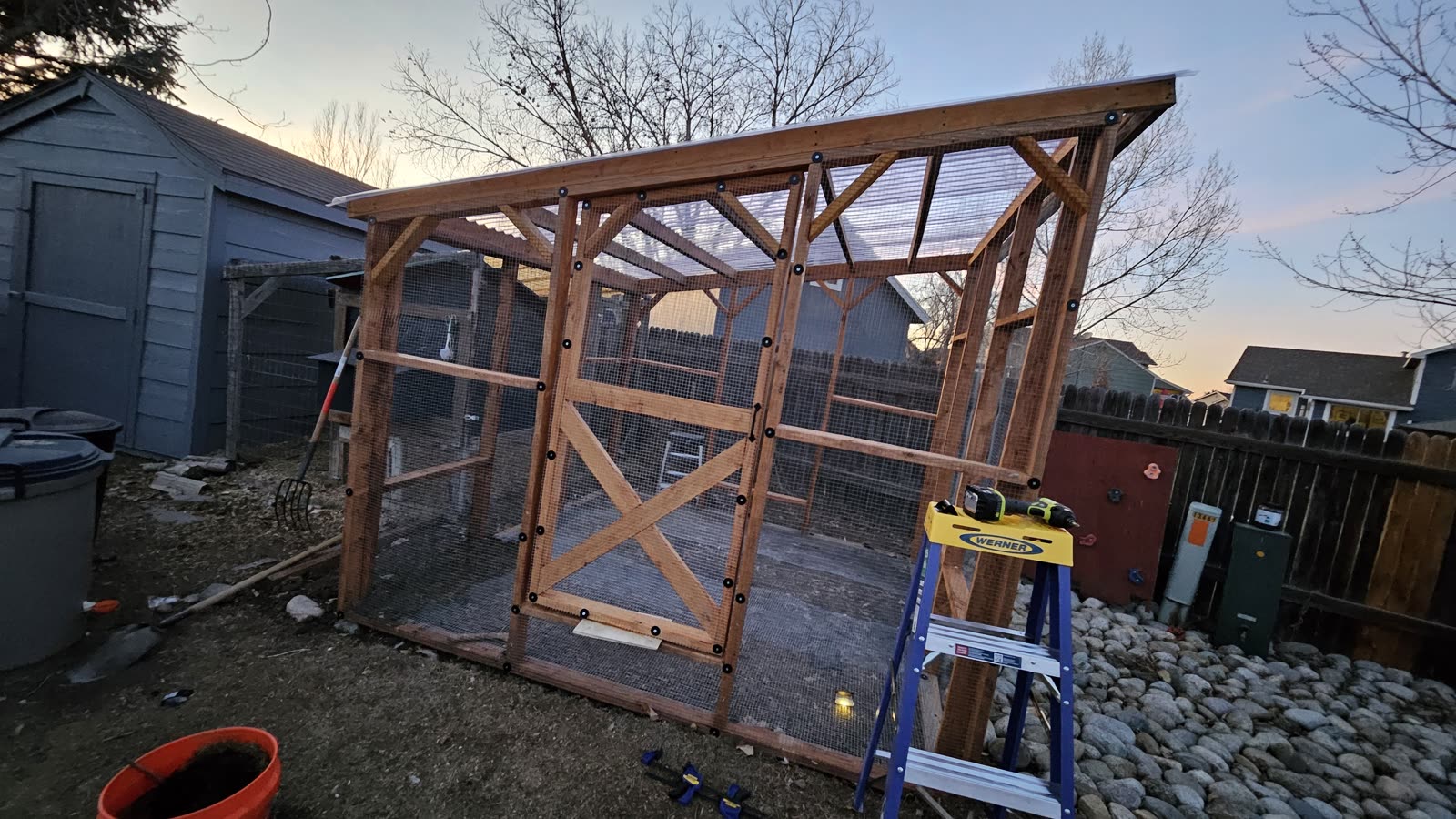 The braced door frame being fitted into the run.